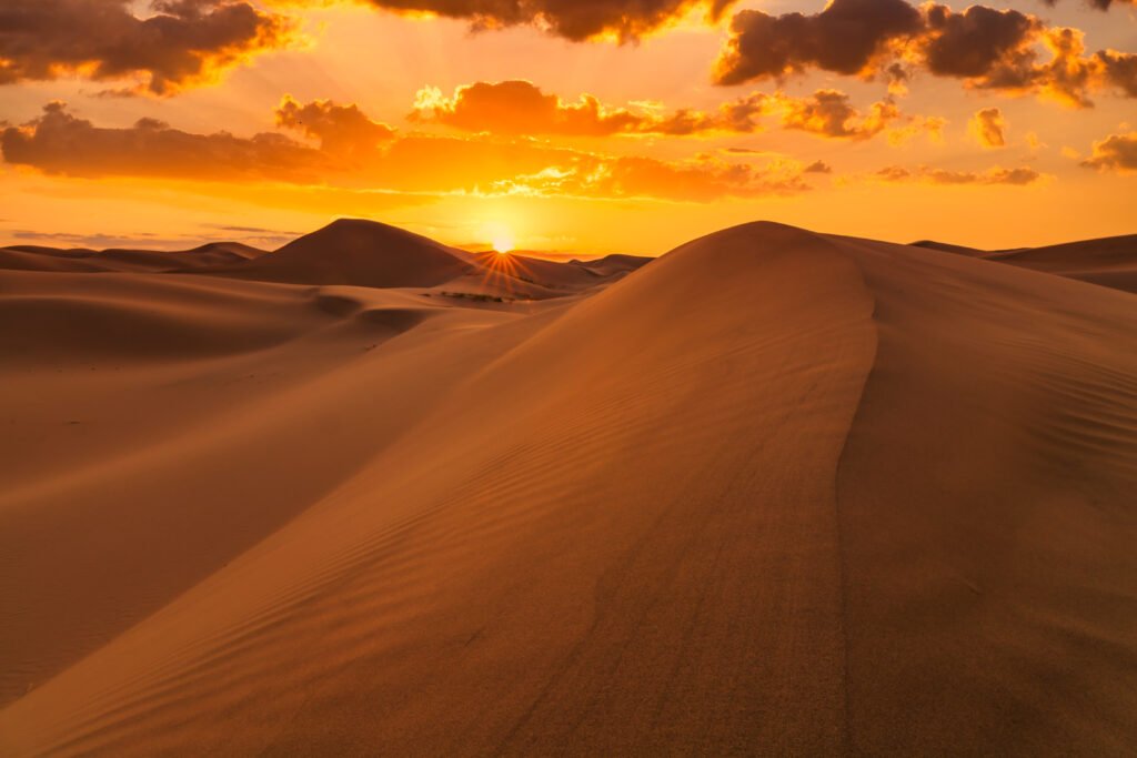 Beautiful sunset over the sand dunes in the Arabian Empty Quarter Desert, UAE. Rub' al Khali